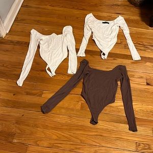 Set of three naked wardrobe size small bodysuits